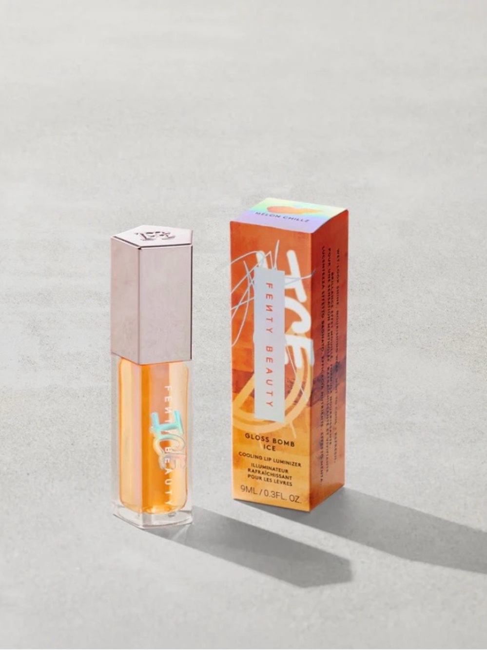 FENTY BEAUTY GLOSS BOMB ICE COOLING LIP LUMINIZER COLOR: MELON CHILLZ